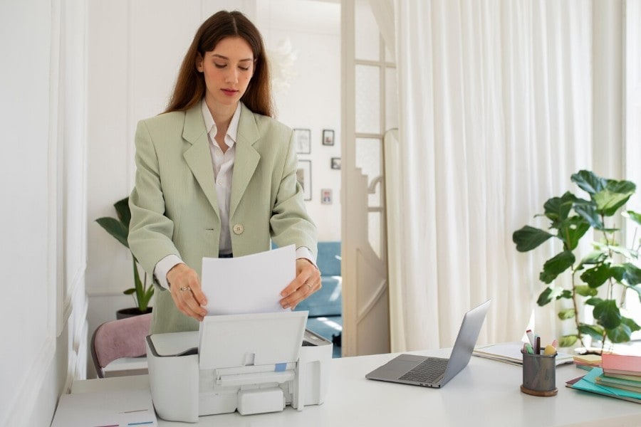 woman working in office using printer