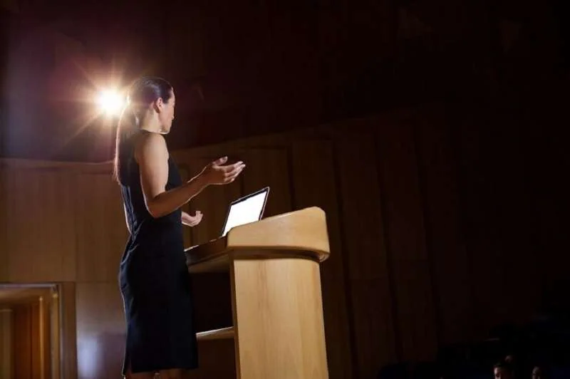 female executive giving a speech