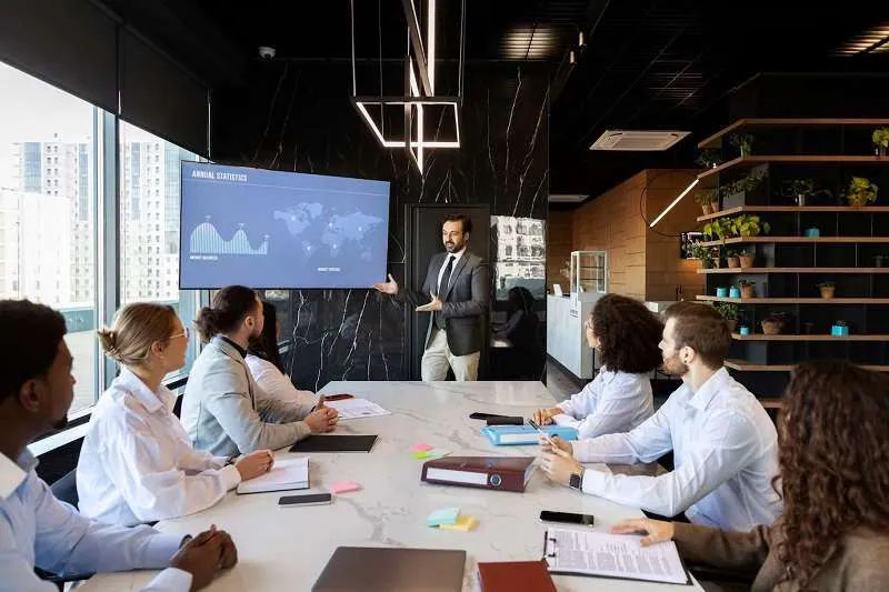 man doing oral presentation at event