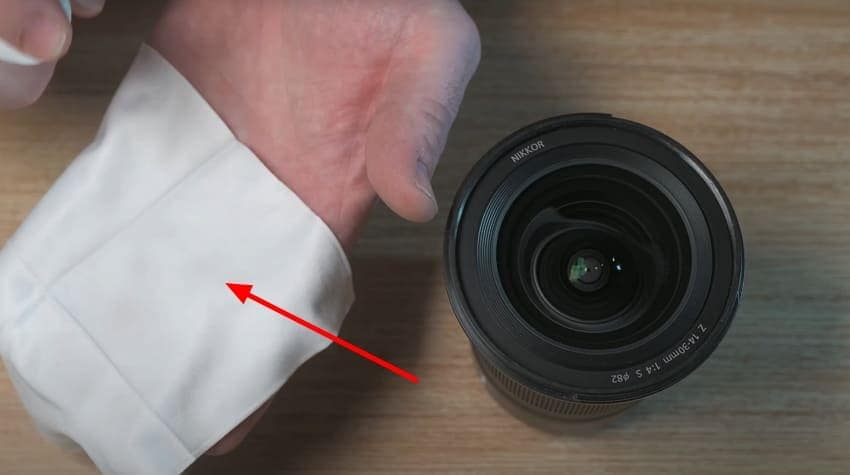 wipe lens with solution