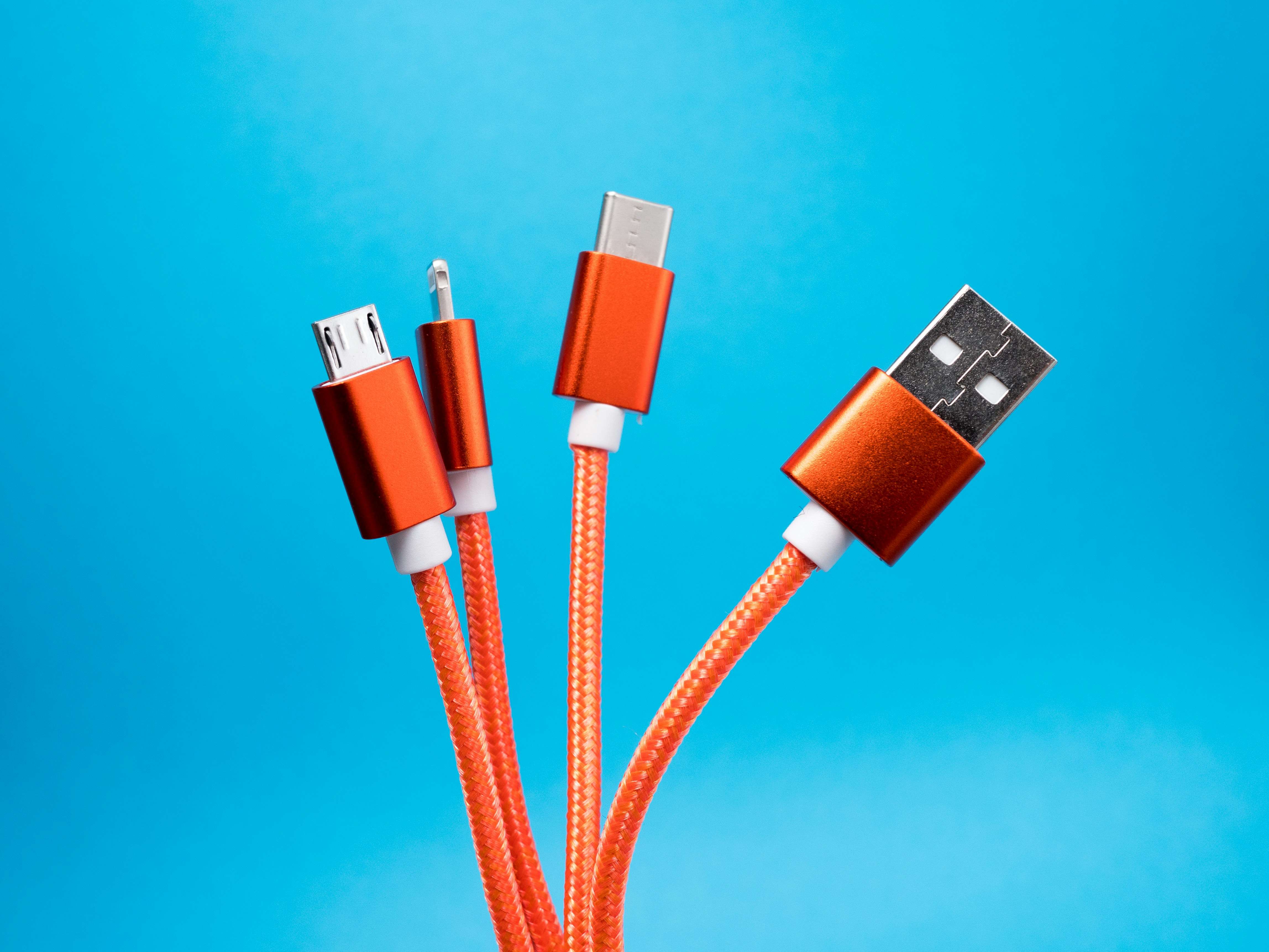 four orange usb cables 
