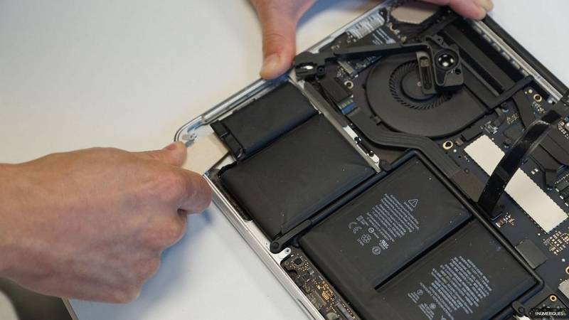 remove the battery from a water damaged mac
