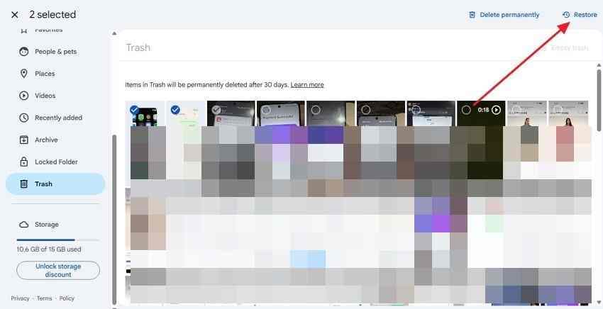 selected photos in google photos trash with restore action