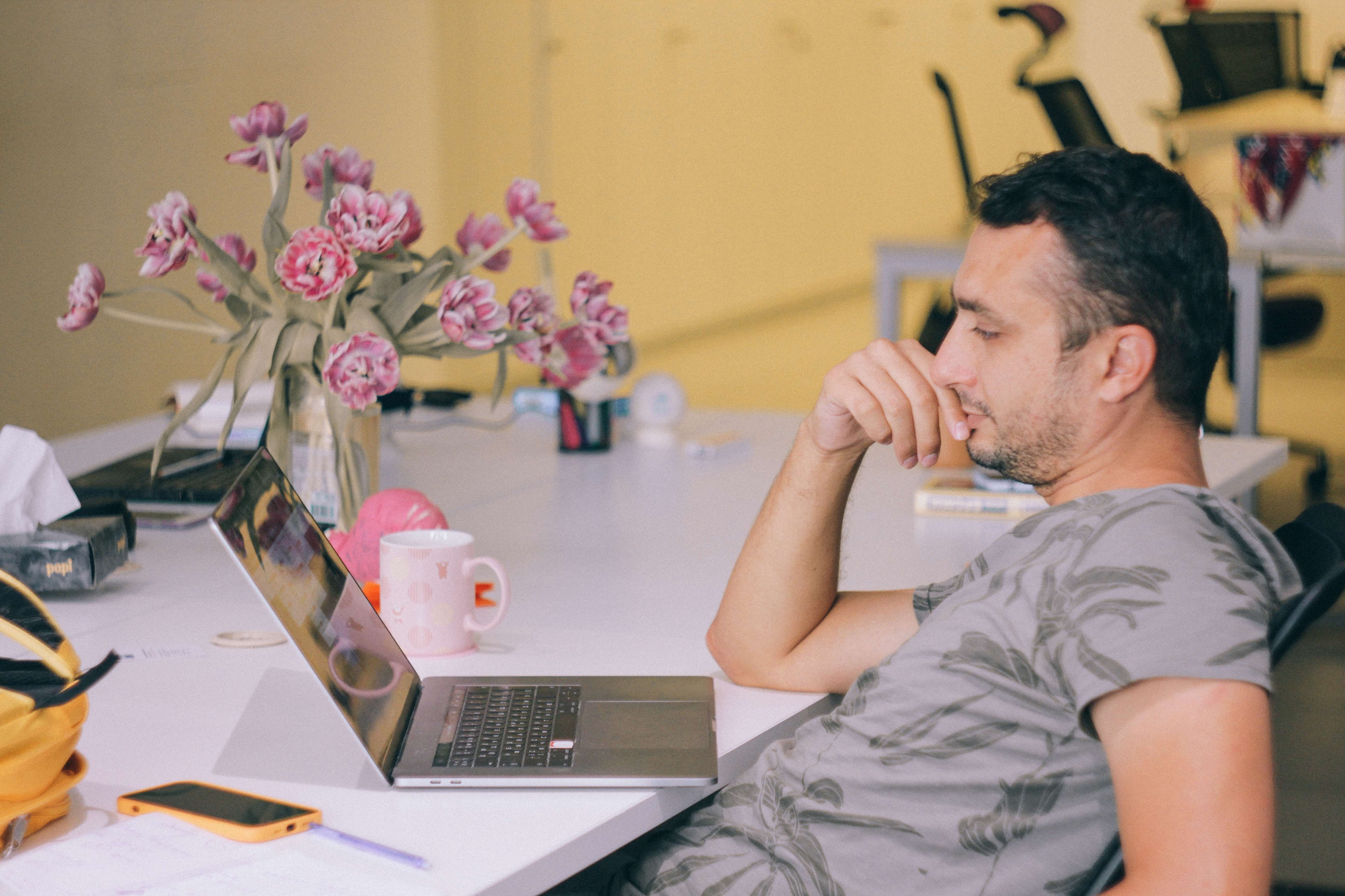 person sitting in front of laptop 