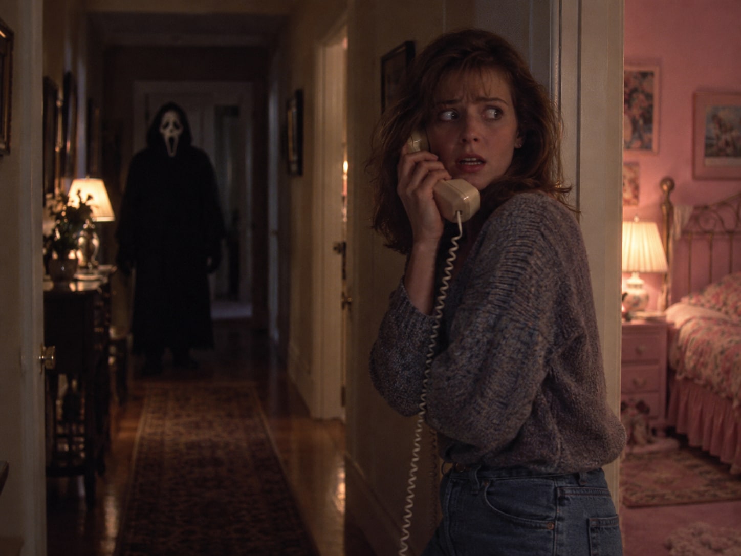 1990s film-style horror hallway scene with a corded telephone