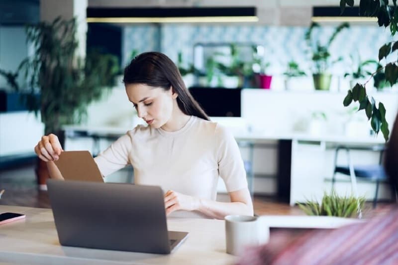 woman making translations using laptop