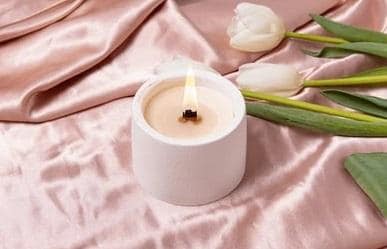 candle with fabric as a background