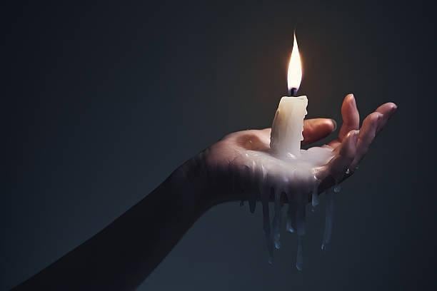 hand holding the candle