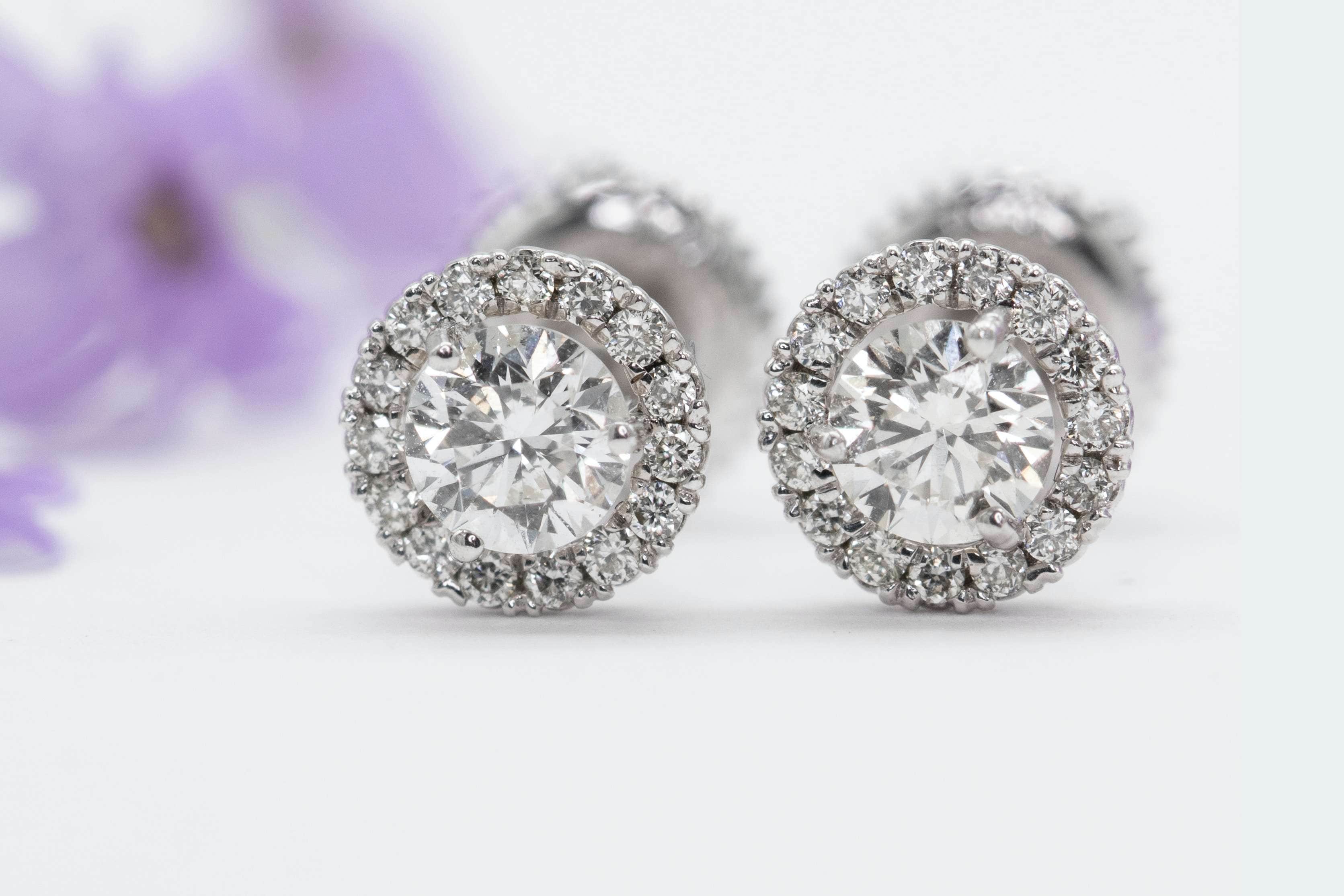 two silver diamond earrings 