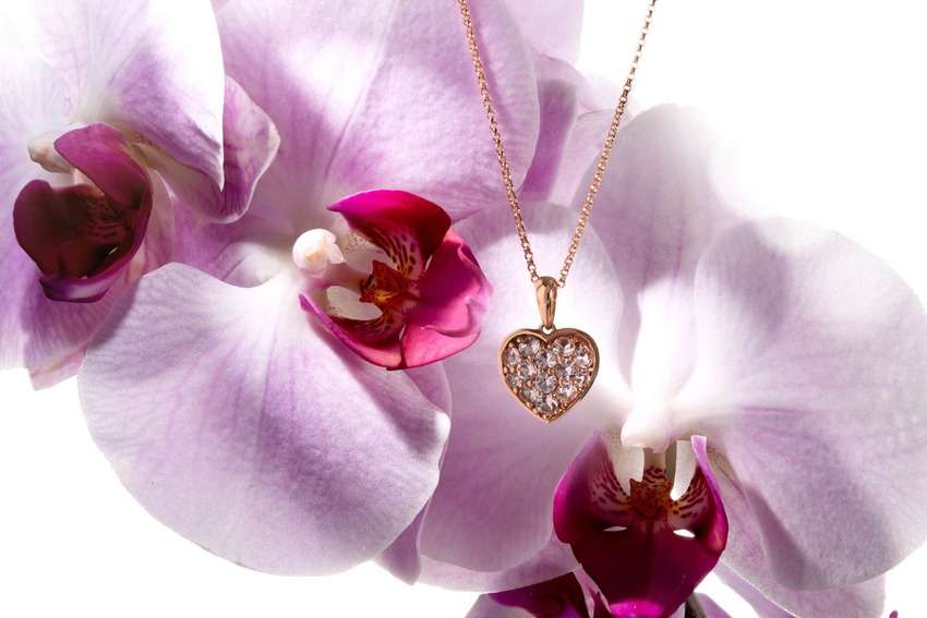 yellow gold jewelry photography with orchids